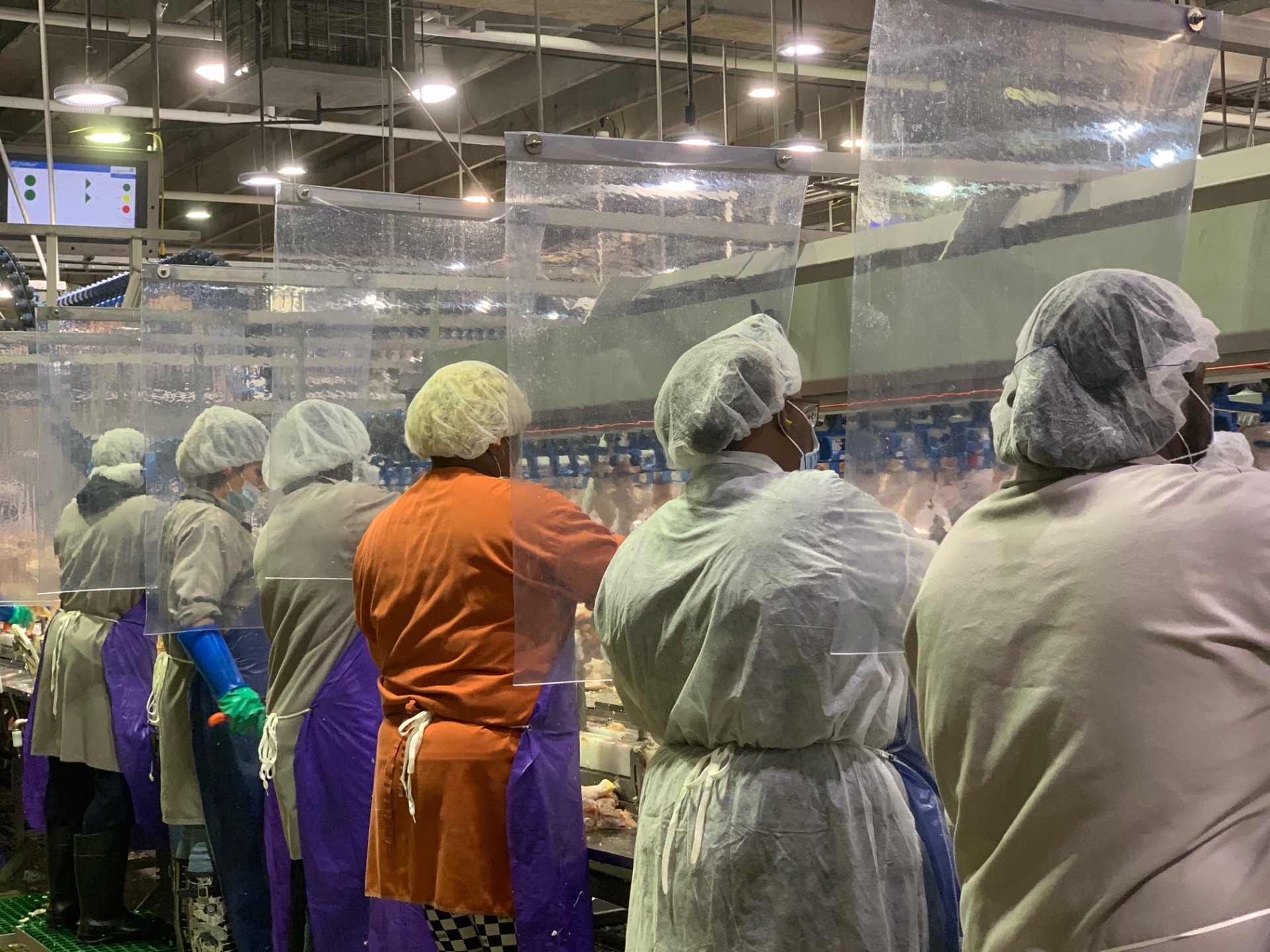 Manufacturing line workers in a processing facility